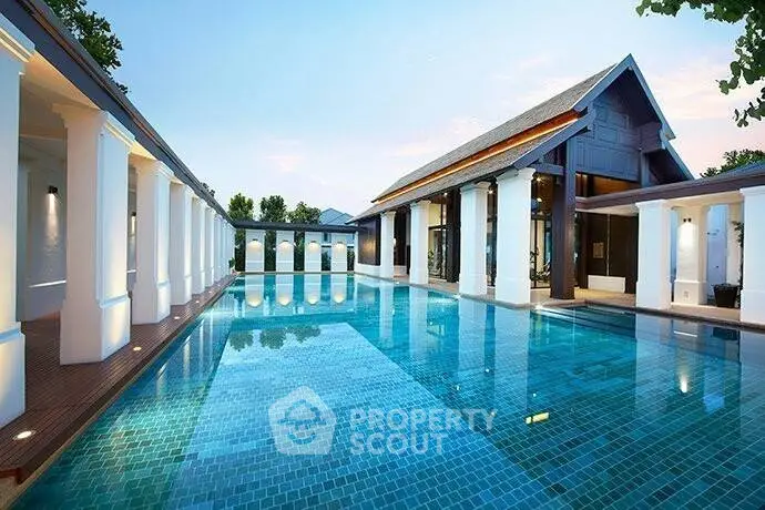 Luxurious outdoor pool with elegant architecture and serene surroundings.