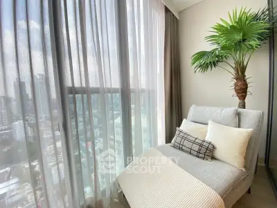 Luxurious high-rise apartment with stunning city view and cozy lounge area.