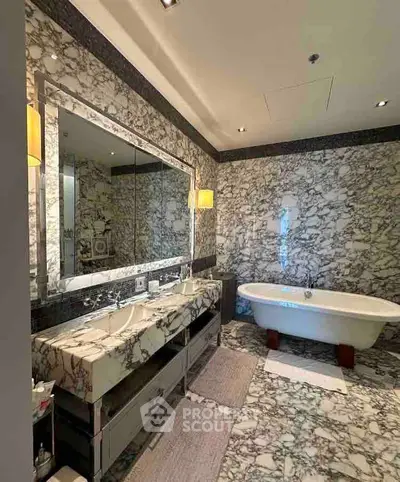 Luxurious marble bathroom with freestanding bathtub and double vanity