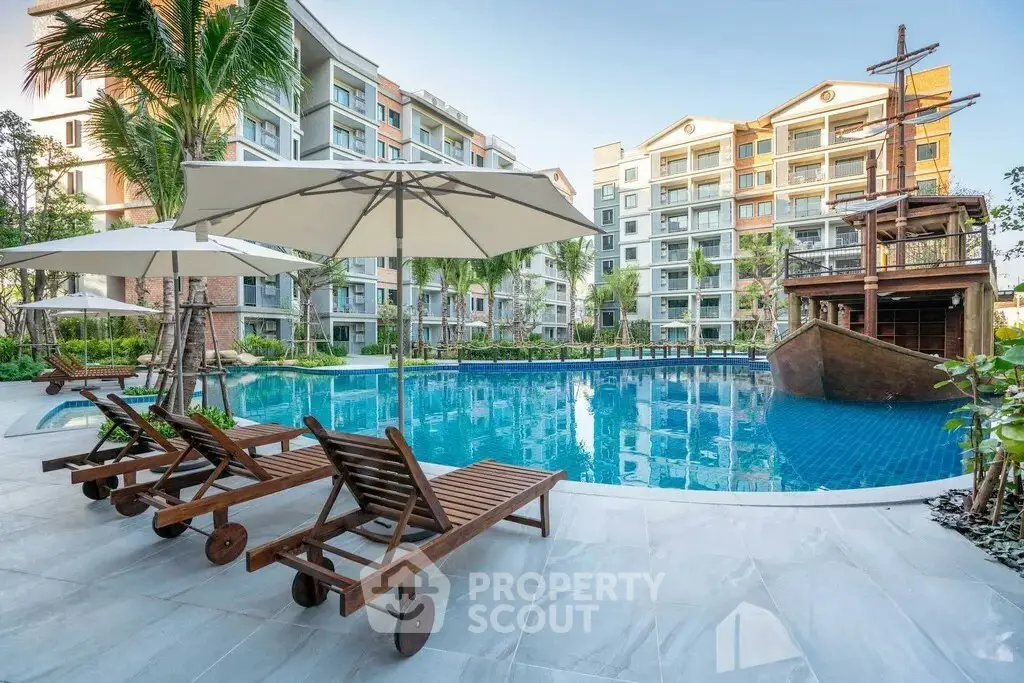 Luxurious apartment complex with stunning pool and unique ship-themed decor, perfect for relaxation and leisure.