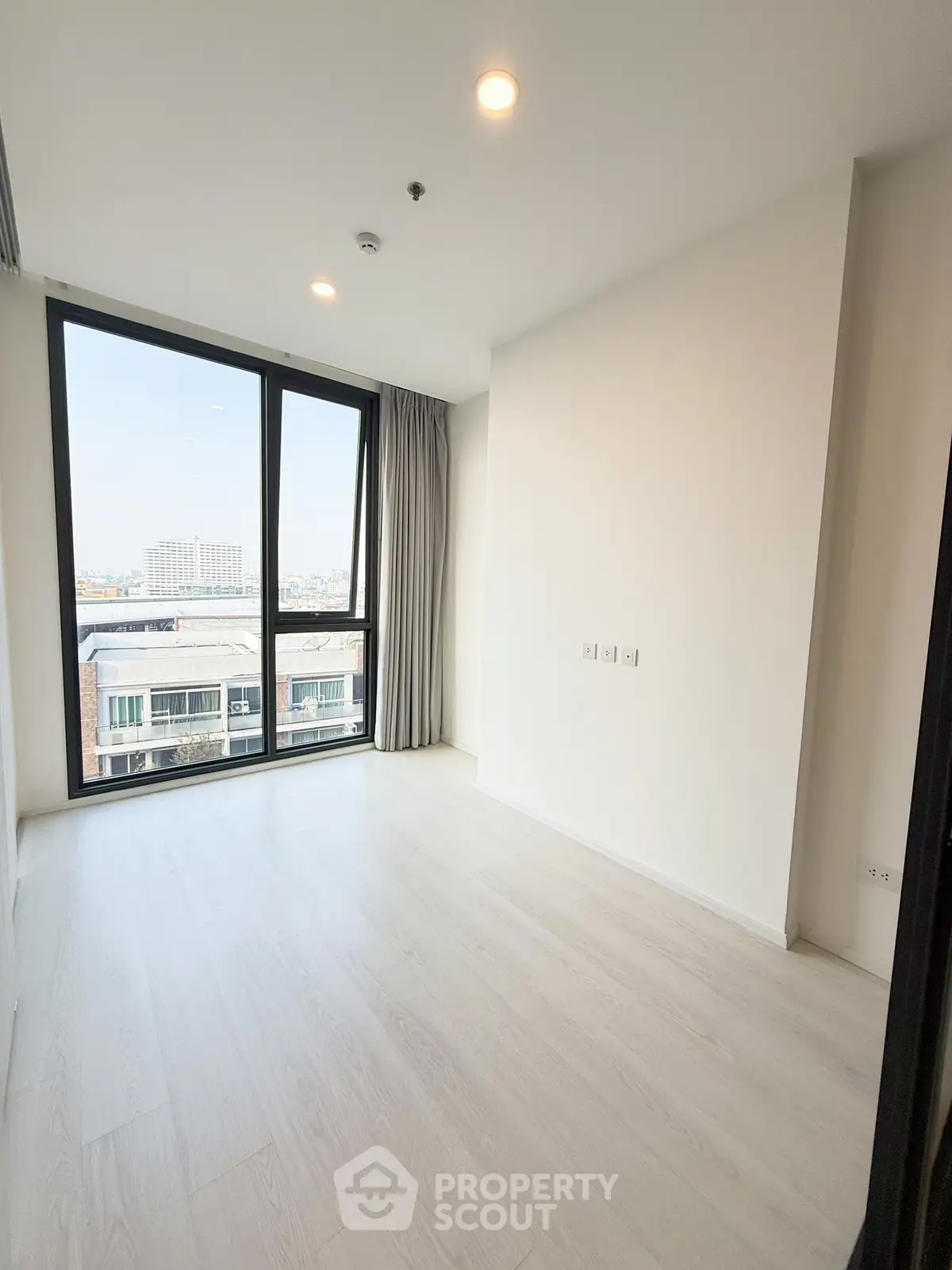 Spacious corner unit with large windows offering a great view, perfect for modern living.