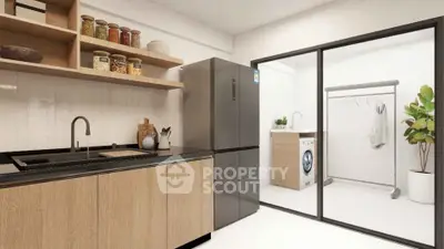 Modern kitchen with sleek appliances and adjacent laundry area in stylish apartment.