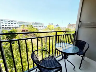 Charming balcony with city view, perfect for relaxation and enjoying the outdoors.