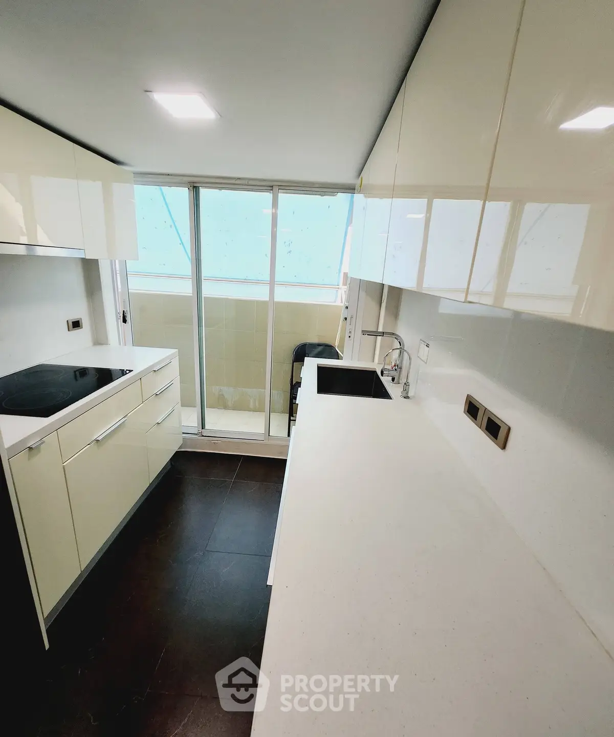 Sleek modern kitchen with closed layout and ample counter space