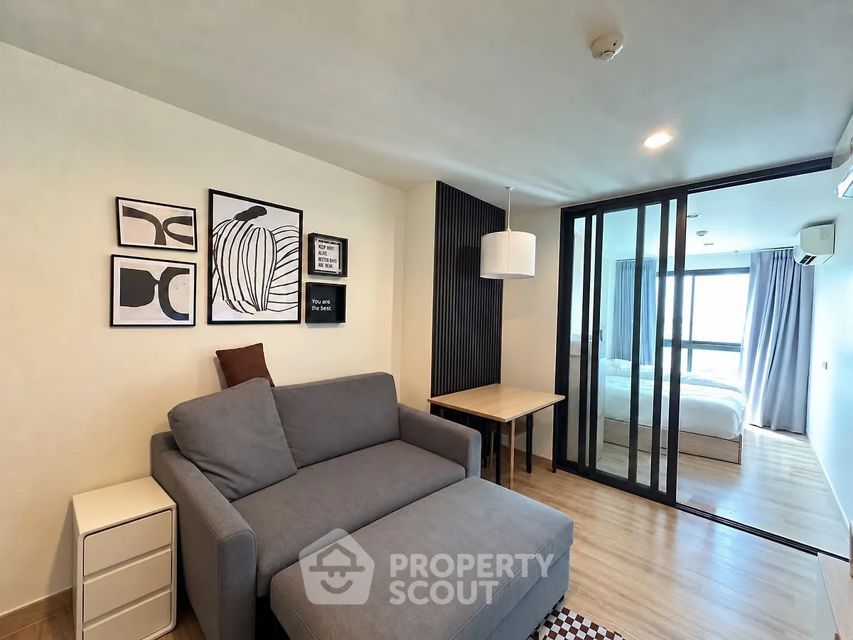 Modern living room with stylish decor and cozy seating in a contemporary apartment.