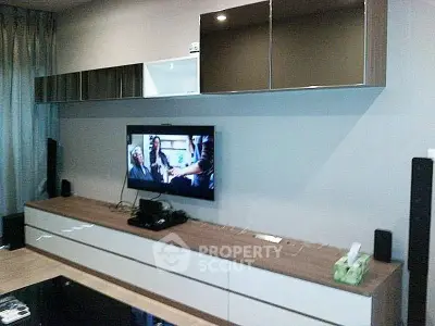 Modern living room with sleek entertainment unit and flat-screen TV