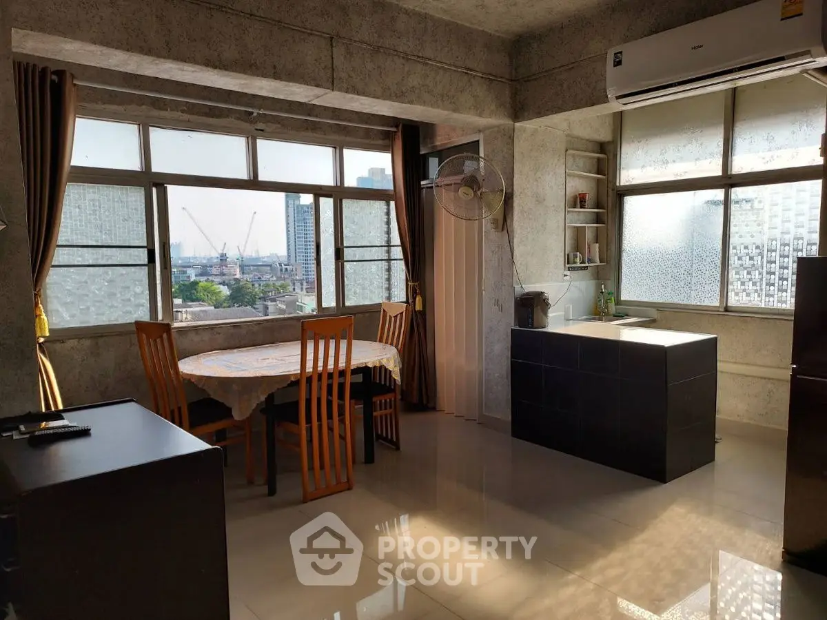 Spacious modern kitchen with city view and natural light