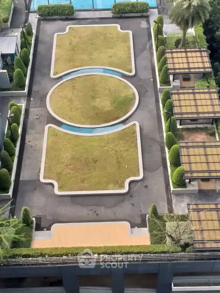 Stunning aerial view of modern rooftop garden with unique geometric design and lush greenery.