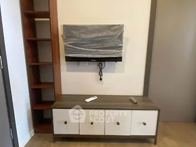 Modern living room with stylish TV cabinet and shelving unit, perfect for contemporary homes.