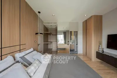 Luxurious modern bedroom with elegant wood paneling and sleek decor