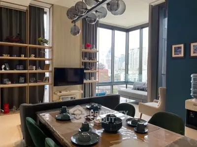 Luxurious modern living room with floor-to-ceiling windows and elegant dining area in urban apartment.