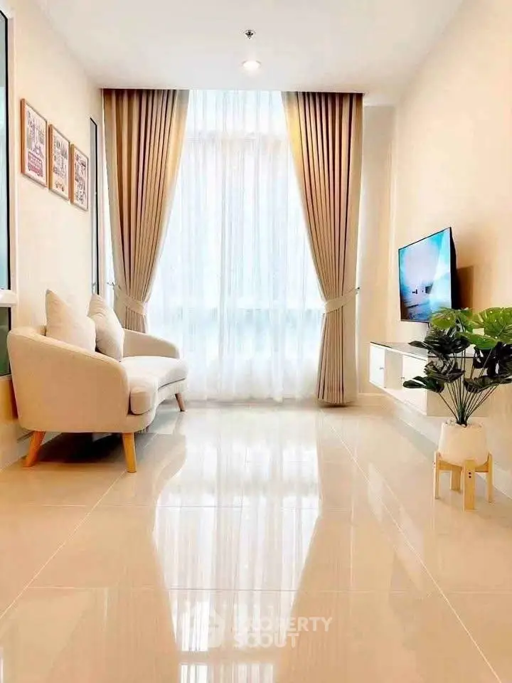 Bright and modern living room with elegant decor and large window view.