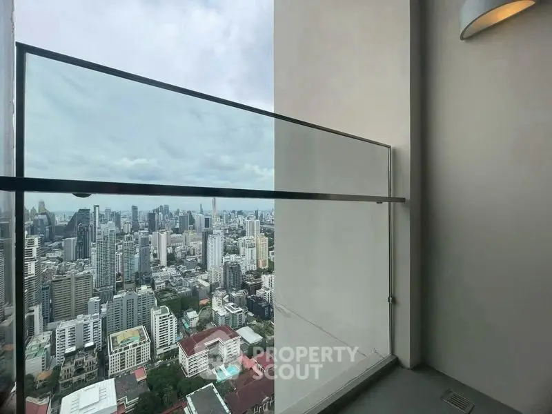 Stunning cityscape view from a modern high-rise balcony, perfect for urban living.