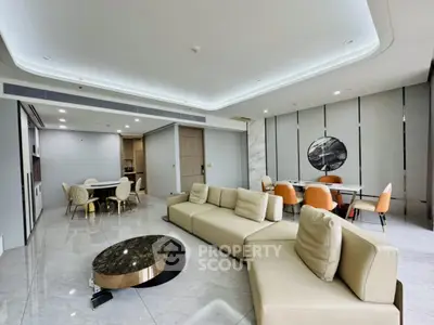 Luxurious modern living room with elegant furniture and open dining area