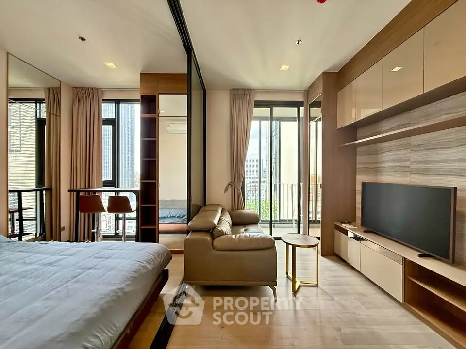 Modern open-plan living room with balcony view and stylish decor