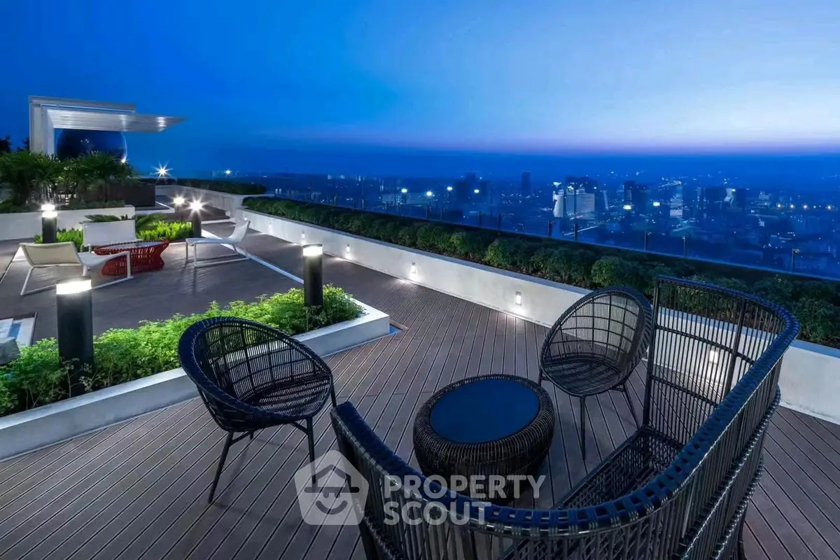 Stunning rooftop terrace with panoramic city views and modern outdoor seating.