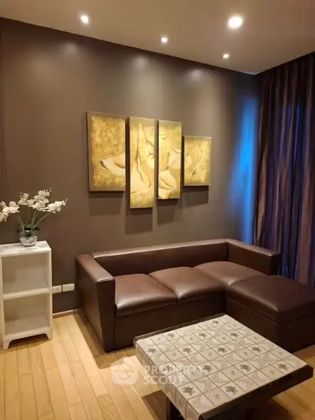 Elegant living room with brown leather sofa and modern art decor