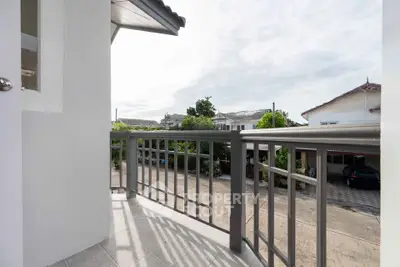 Charming balcony with street view in a serene neighborhood