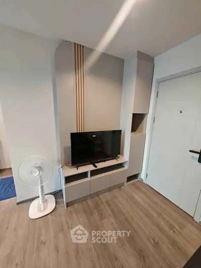 Modern living room with sleek TV stand and minimalist decor