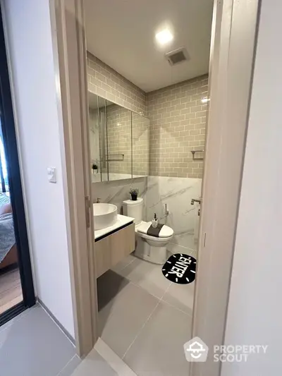 Modern bathroom with sleek design and stylish fixtures in a contemporary apartment.