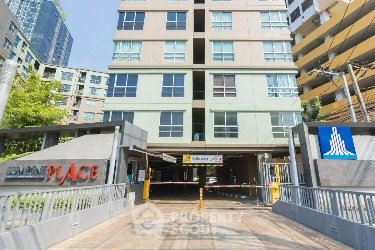 Modern apartment building entrance with clear signage and secure access.