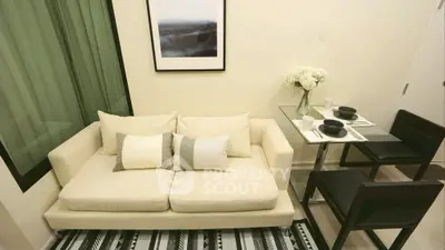 Cozy living room with modern sofa and dining area, perfect for urban living.