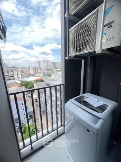 Modern balcony with washing machine and city view, perfect for urban living.