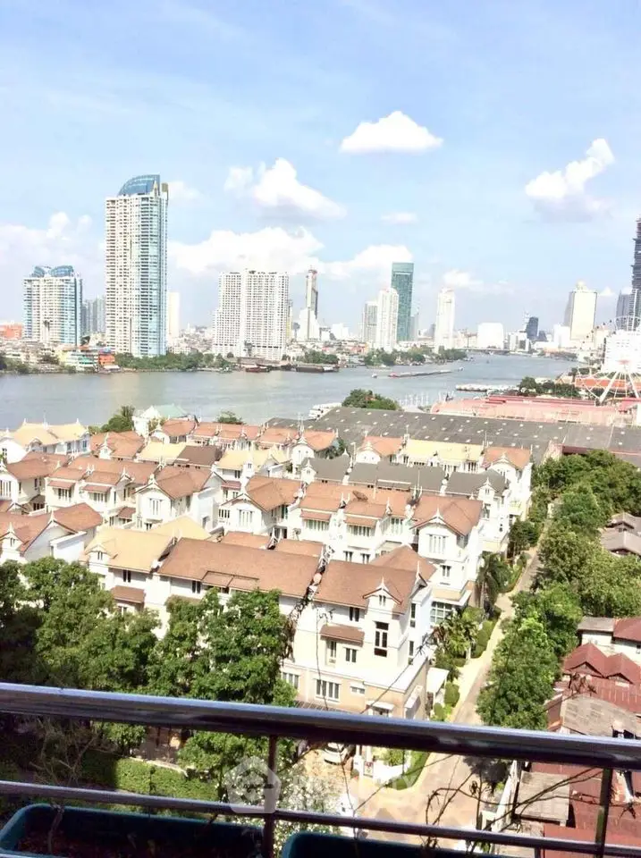 Stunning cityscape view from balcony overlooking river and modern skyline