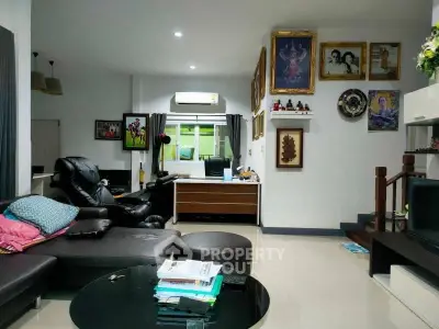 Spacious living room with modern decor and comfortable seating, ideal for family gatherings.