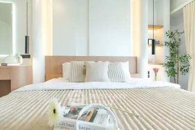 Luxurious modern bedroom with elegant decor and soft lighting