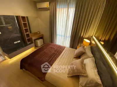 Luxurious bedroom with elegant decor and ambient lighting, featuring a cozy bed and stylish furnishings.