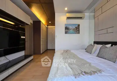 Modern bedroom with stylish decor and air conditioning in a luxury apartment.