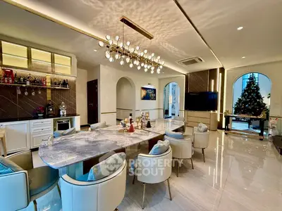 Luxurious modern living room with elegant dining area and festive decor