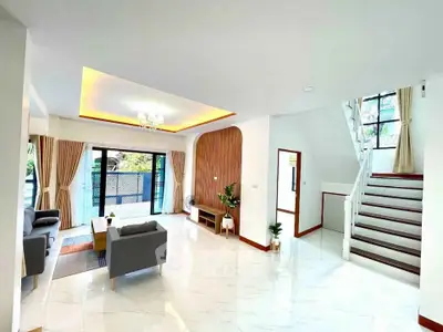 Spacious modern living room with elegant decor and natural light
