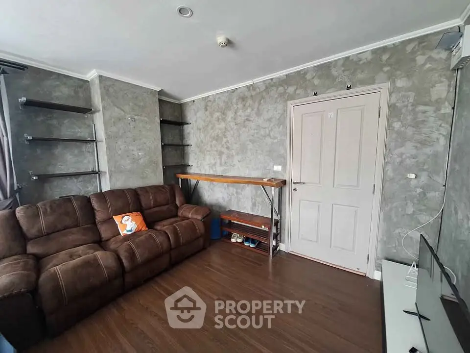 Cozy living room with brown sofa and modern decor