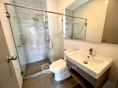 Modern bathroom with glass shower and sleek fixtures