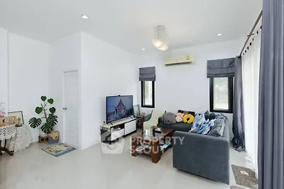 Modern living room with sleek design and cozy seating area