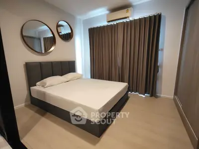 Modern bedroom with stylish mirrors and elegant curtains