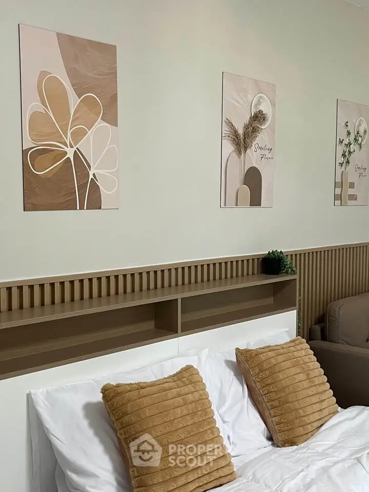 Stylish bedroom with modern decor and cozy pillows, perfect for relaxation and comfort.