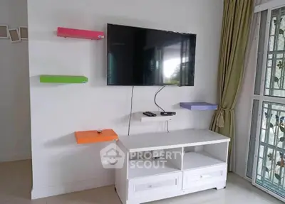 Modern living room with wall-mounted TV and colorful shelves