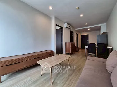 Modern living room with wooden furniture and neutral tones