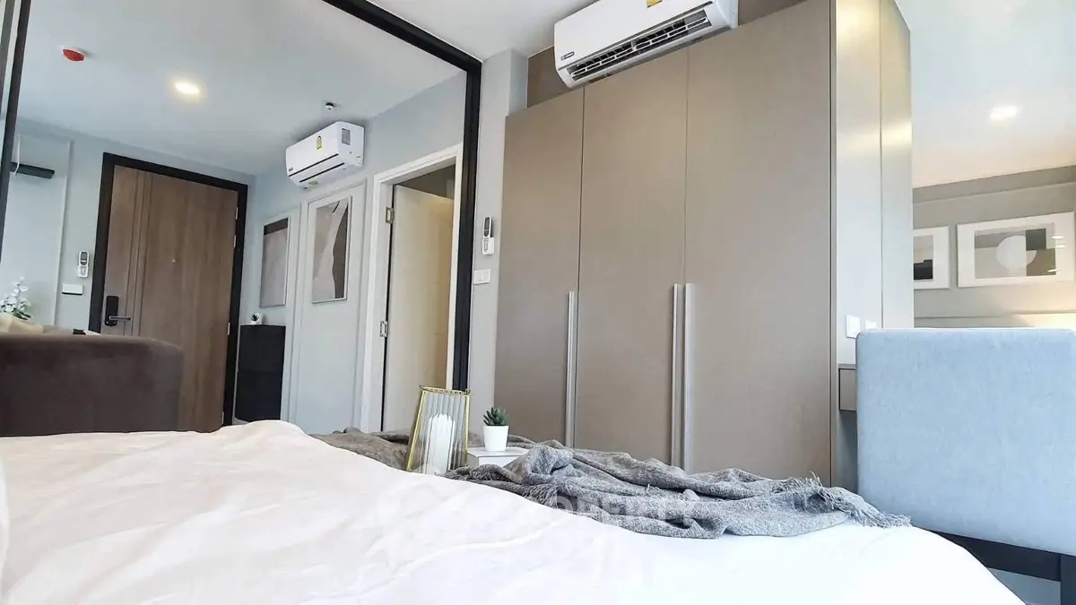 Modern bedroom with sleek design and air conditioning unit