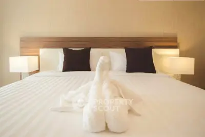 Luxurious bedroom with elegant decor and plush bedding, perfect for relaxation and comfort.