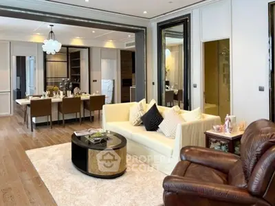 Luxurious open-plan living and dining area with elegant decor and modern furnishings.