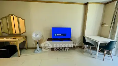 Cozy living room with modern TV setup and stylish furniture