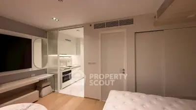Modern bedroom with open kitchen layout and sleek design