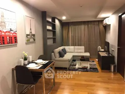 Modern living room with stylish decor and cozy seating area, perfect for relaxation and entertainment.