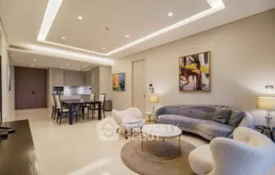 Luxurious modern living room with elegant furniture and open kitchen layout