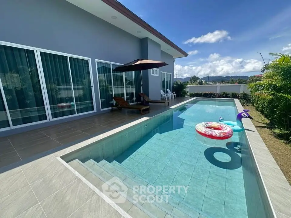 Luxurious modern villa with private pool and sun deck, perfect for relaxation and entertainment.