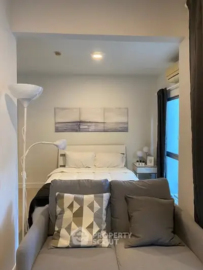 Cozy bedroom with modern decor and natural light